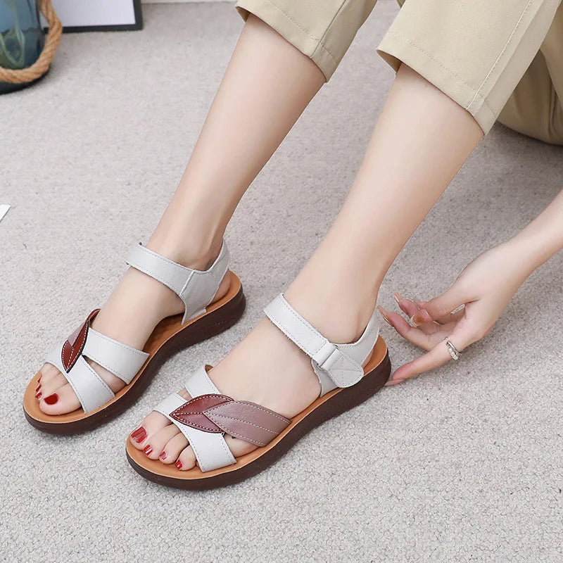 Adjusting the hook-and-loop back strap on the Ivy sandals